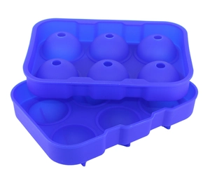 Close-up of two blue 6-cavity silicone ice ball molds stacked on a clean white background