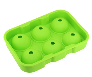 Detail view of a green food-grade silicone mold for making six large spherical ice balls