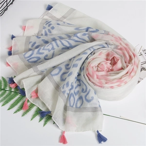 Detailed close-up of ripple print scarf with delicate pink and blue tassel trim edges