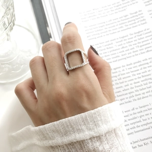 Close-up of S925 sterling silver square ring featuring micro-pave cubic zirconia stones