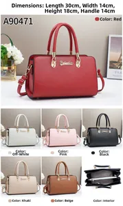 Détails du sac à main en cuir grainé avec boucles dorées et compartiments zippés internes