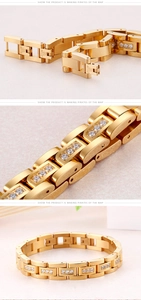 Detail of gold 316L stainless steel bracelet showing crystal inlay and 316L engraving