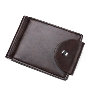 Detailed view of dark brown leather wallet texture with silver metal snap button closure