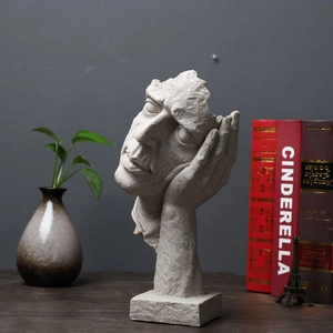 Detail of creative abstract thinker statue on a desktop with modern home decor