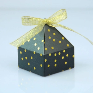 Elegant emerald green pyramid gift box with gold foil polka dots and a golden ribbon