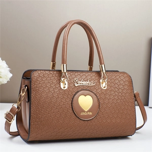 Brown crocodile texture handbag with gold heart pendant and dual handles for women