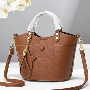 Brown lychee-grain faux leather handbag with star charm and golden hardware detail
