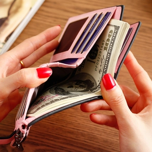 Pink and black bi-fold wallet for women showing internal card slots and cash pocket