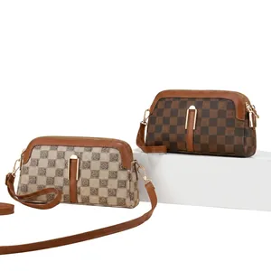 Scene display of vintage checkered crossbody bags with golden hardware and leather straps