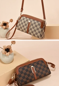 Close-up of retro checkerboard crossbody bags with double zippers and gold metal buckles