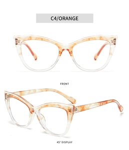 Detail view of orange cat-eye eyewear frame with premium tortoise shell pattern