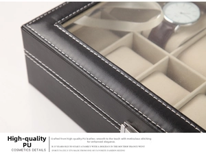 Close-up of black PU leather watch box with white stitching and silver metal lock