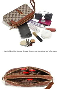 Macro view of brown checkered handbag interior showing multiple pockets and storage space