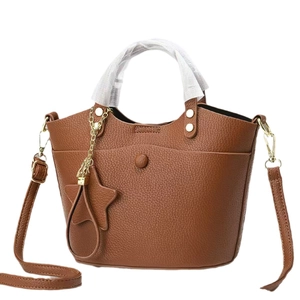 Classic brown pebble leather handbag for women with star charm and adjustable strap
