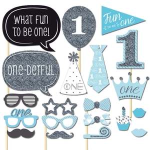 Detailed view of blue and silver glitter 1st birthday photo booth props with wooden sticks