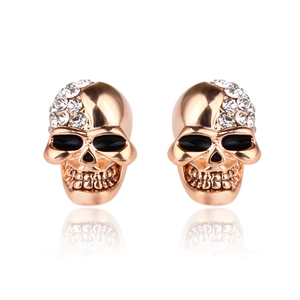 Retro polished skull stud earrings with sparkling white crystals in rose gold finish