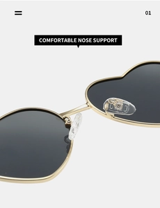 Detail of comfortable silicone nose pads on gold metal heart-shaped sunglasses