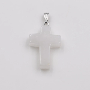 Macro shot of white natural stone cross pendant with polished silver metal bail