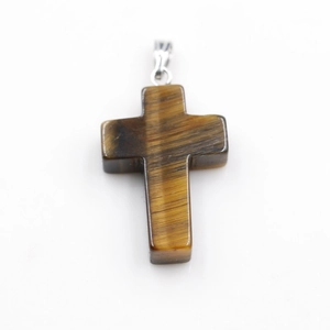 Detailed view of a natural tiger eye stone cross pendant with a polished silver-toned bail