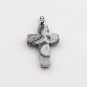Detailed macro view of natural stone cross pendant with unique grey and white agate texture