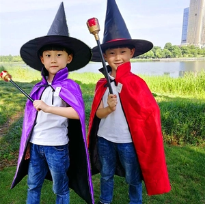 Wizard costume detail featuring a black pointed hat, velvet cape, and golden magic wand set