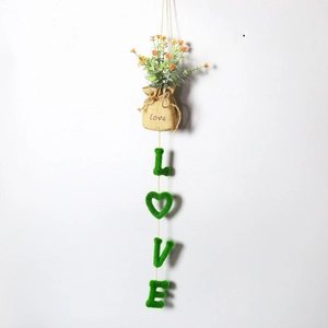 Vertical wall hanging decor with artificial orange flowers and plush LOVE letter pendants