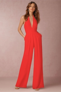 Detail view of the red deep V-neck halter jumpsuit with a stylish wide leg cut