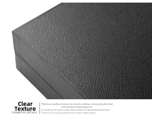 Close-up of the black leather texture and fine stitching on the watch storage box
