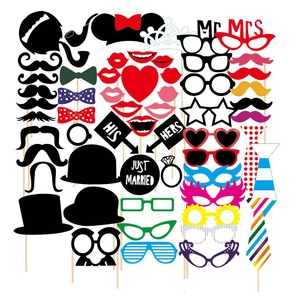 Detailed collection of 16-piece wedding photo booth props with gold glitter and fun shapes