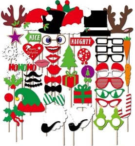Flat lay of 33-piece Christmas photo booth props with Santa hats and reindeer antlers
