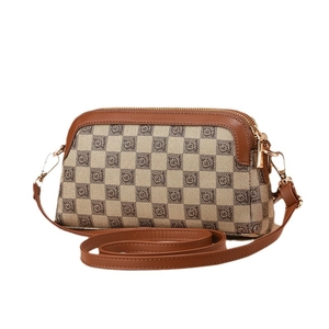 Classic checkered crossbody bag with brown faux leather trim and golden hardware