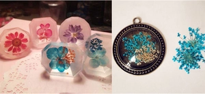 Detailed view of dried narcissus flowers encapsulated in clear resin for DIY jewelry making