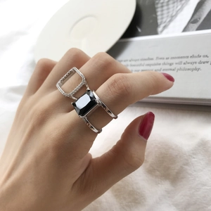 Detailed view of S925 silver rings set with square black stone and micro pavé cz stones