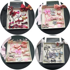 Detail view of assorted velvet hair accessories gift sets in four elegant color palettes