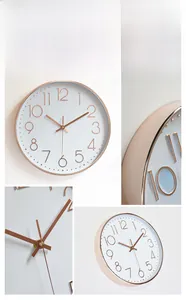 Detail view of the rose gold electroplated hands and 3D numeric dial on wall clock