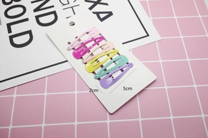 Close-up of six colorful candy-colored teardrop hair clips with dimensions on card