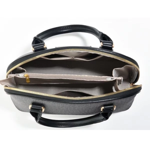 Detail view of the bag interior with a central zip compartment and herringbone lining