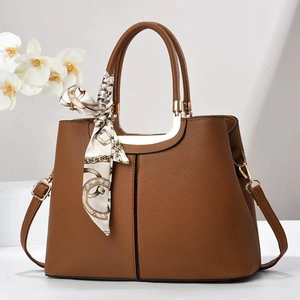 Brown litchi leather tote bag with silk scarf and gold hardware for women