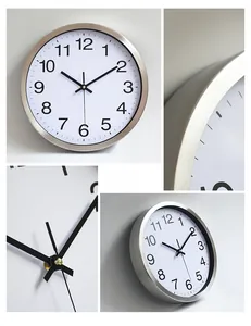 Macro detail of brushed aluminum frame and Arabic numerals on a modern silent wall clock