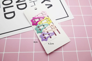 Star shaped candy colored hair clips set on display card showing dimensions