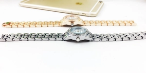 Side view of high-end fashion rhinestone ladies' watches in gold and silver finishes