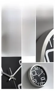 Detail of modern wall clock featuring a brushed silver metal frame and large numeric font