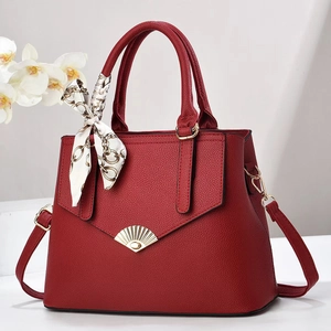 Elegant red lychee grain tote bag with gold fan lock and stylish silk scarf detail