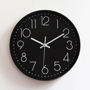 Minimalist 12-inch black silent wall clock with bold 3D white numerals for modern home