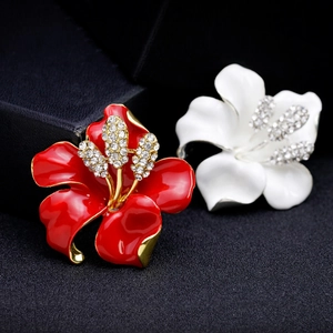 Elegant hibiscus flower brooches with red and white enamel finish and crystal centers