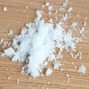 Artificial dry snow powder for Christmas window decoration on rustic wood background