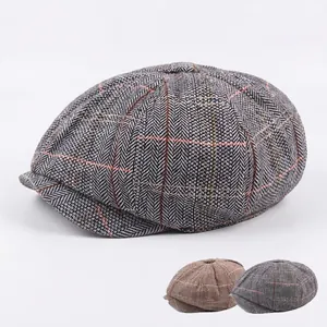 Classic herringbone tweed newsboy cap for men featuring a vintage British wool style