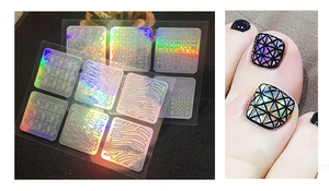 Macro detail of laser holographic nail art stickers with zebra and geometric patterns