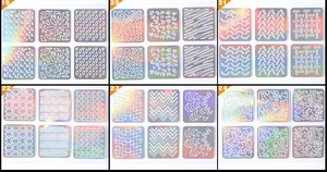 Macro detail of laser 3D holographic nail art stickers with geometric and floral patterns