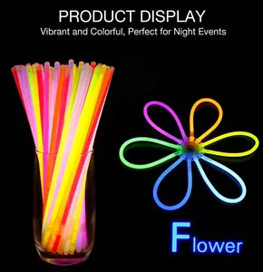 Flower-shaped luminous glow stick assembly on black background with vibrant neon colors